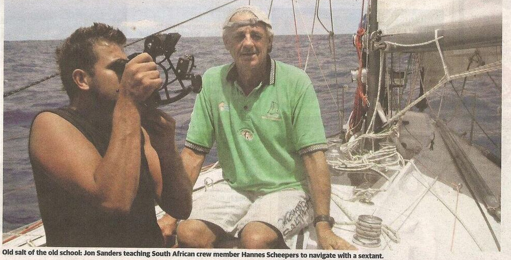 Newspaper clipping: Hannes Scheepers taking a sextant sight aboard a yacht at sea, with Jon Sanders seated beside him