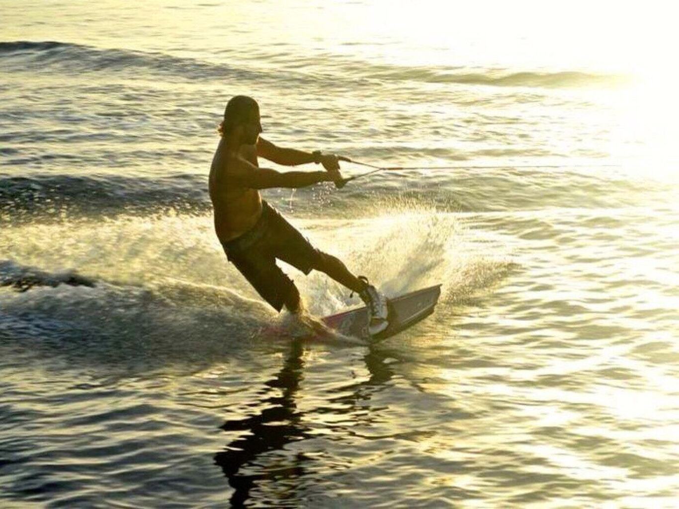 Wakeboarding behind the catamaran